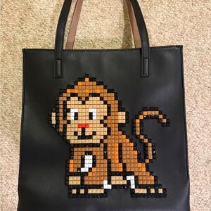 Black Braccialini Tua Tote Bag with Pixel Art Monkey